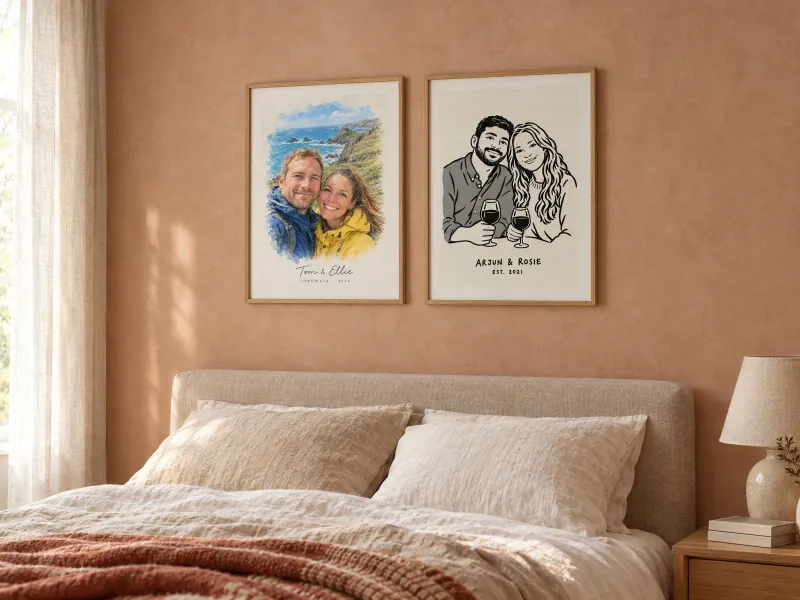 Bedroom with a watercolour couple portrait and a bold ink couple portrait in oak frames above a linen bed